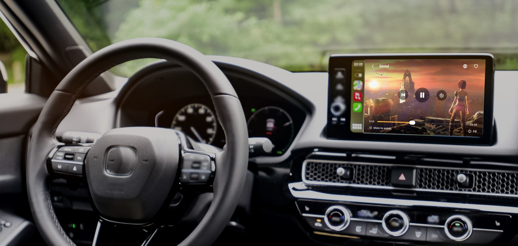 A car's dashboard at dusk with a film playing in Car Cinema on the CarPlay display